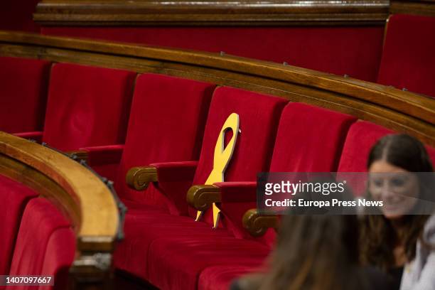 The seat of the deputy of Junts and exconseller Lluis Puig with a yellow ribbon, in a plenary session of the Parliament, on July 6 in Madrid, Spain....