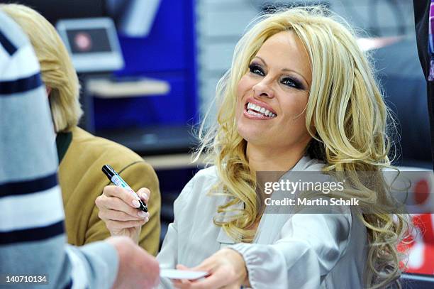 Actress Pamela Anderson signs autographs at Lugner City on March 05, 2012 in Vienna, Austria.