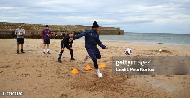 Ali Koiki of Northampton Townin action during a game of football cricket during a pre-season training session at East Sands Beach on July 06, 2022 in...