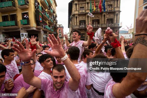 Revellers enjoy the atmosphere during the opening day or 'Chupinazo' of the San Fermin Running of the Bulls fiesta on July 06, 2022 in Pamplona,...