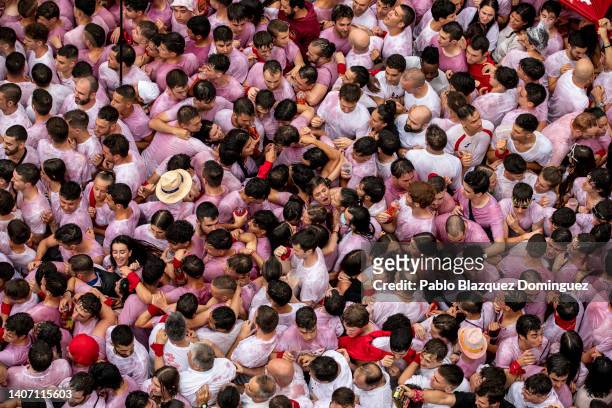 Revellers enjoy the atmosphere during the opening day or 'Chupinazo' of the San Fermin Running of the Bulls fiesta on July 06, 2022 in Pamplona,...