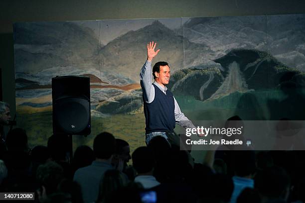 Republican presidential candidate, former U.S. Sen. Rick Santorum waves as he arrives to speak during a campaign rally at the Dayton Christian School...