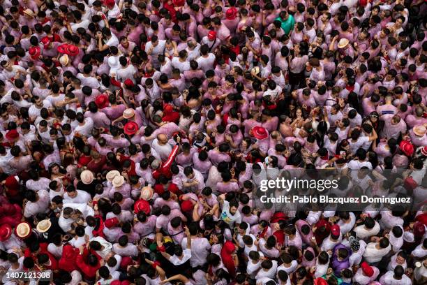 Revellers enjoy the atmosphere during the opening day or 'Chupinazo' of the San Fermin Running of the Bulls fiesta on July 06, 2022 in Pamplona,...