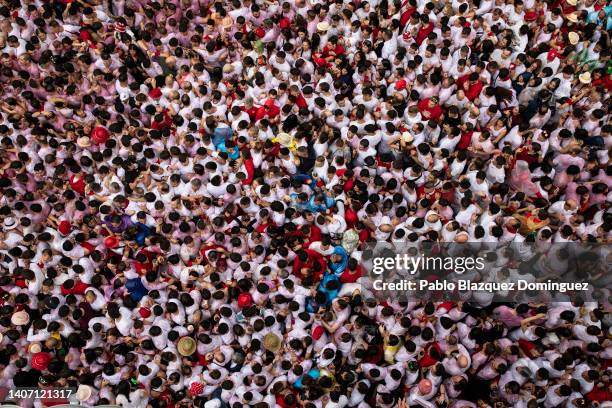 Revellers enjoy the atmosphere during the opening day or 'Chupinazo' of the San Fermin Running of the Bulls fiesta on July 06, 2022 in Pamplona,...