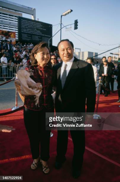 Hong Kong film director John Woo and his wife, Annie Woo Ngau Chun-lung attend the Hollywood premiere of 'Mission: Impossible 2,' held at Mann's...