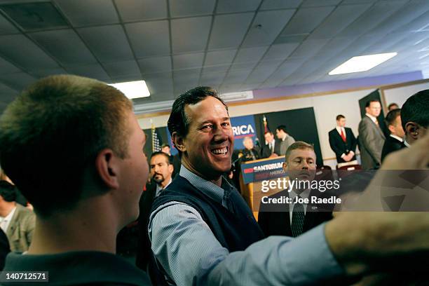 Republican presidential candidate, former U.S. Sen. Rick Santorum greets people during a campaign rally at the Dayton Christian School on March 5,...