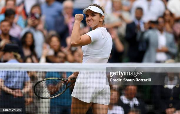 Simona Halep of Romania celebrates winning match point against Amanda Anisimova of The United States during their Women's Singles Quarter Final match...