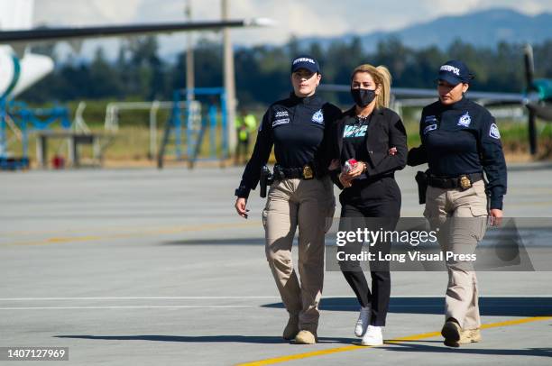 Nini Johana Usuga alias 'La Negra', sister of Colombian drug lord Dairo Antonio Usuga, alias 'Otoniel', is escorted by Interpol police officers...