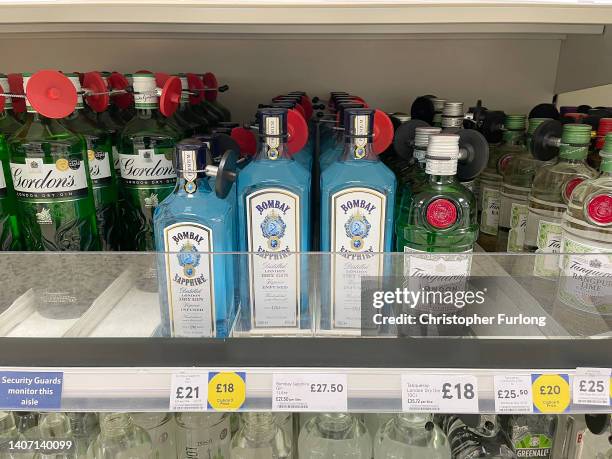 Bottles of gin sit on display in a Tesco supermarket on July 06, 2022 in Northwich, England. The British Retail Consortium recently said food...