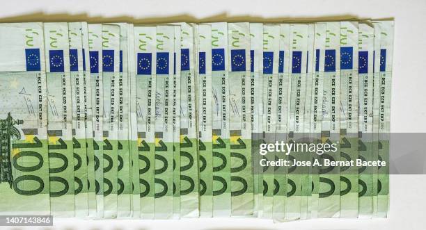 full frame of row of 100 euro bills. - 100ユーロ紙幣 ストックフォトと画像