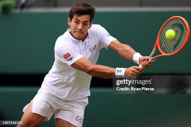 Cristian Garin of Chile plays a backhand against Nick Kyrgios of Australia during their Men's Singles Quarter Final match on day ten of The...