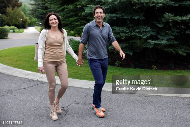 Sheryl Sandberg, outgoing Chief Operating Officer of Meta, and her partner Tom Bernthal walk to a morning session during the Allen & Company Sun...