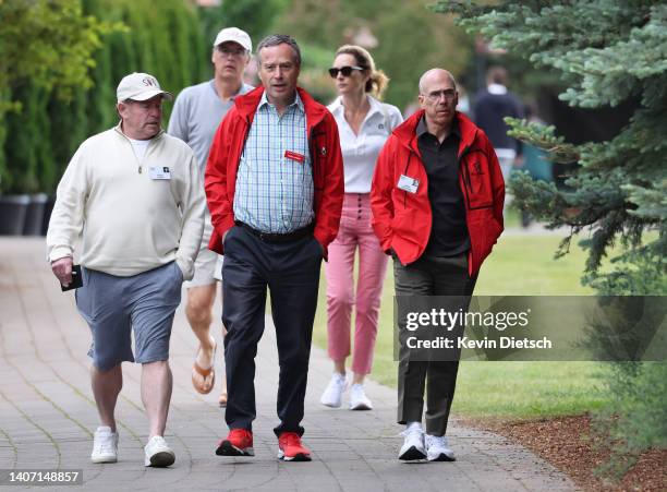 Bobby Kotick, CEO of Activision Blizzard, journalist Lionel Barber and film producer Jeffrey Katzenberg walk to a morning session during the Allen &...