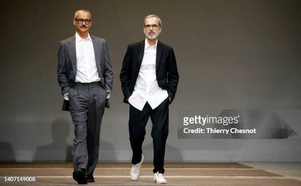 Designers Viktor Horsting and Rolf Snoeren walk the runway at the end of the Viktor & Rolf Haute Couture Fall Winter 2022 2023 show as part of Paris...