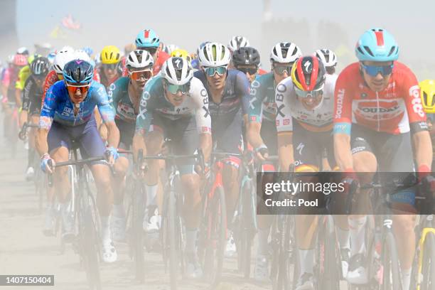 Jakob Fuglsang of Denmark and Team Israel - Premier Tech and Jasper Stuyven of Belgium and Team Trek - Segafredo compete passing through a...