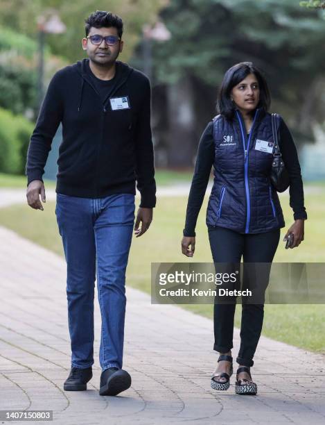 Parag Agrawal, CEO of Twitter, and his wife Vineeta Agarwal, walk to a morning session during the Allen & Company Sun Valley Conference on July 06,...