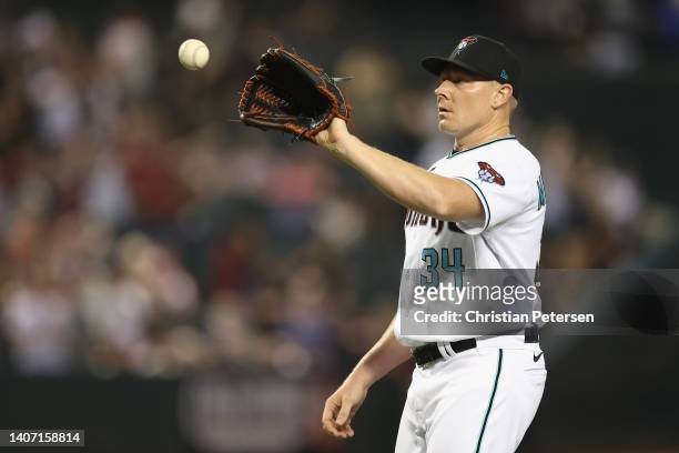 Relief pitcher Mark Melancon of the Arizona Diamondbacks catches a throw back following the MLB game at Chase Field on July 05, 2022 in Phoenix,...