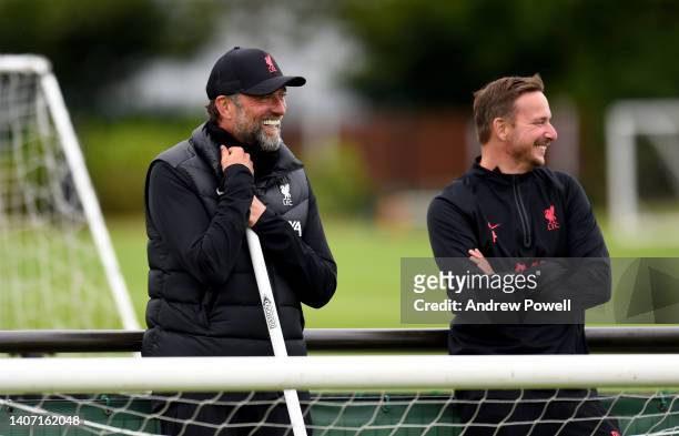Jurgen Klopp manager of Liverpool and Pepijn Lijnders assistant manager of Liverpoolduring a pre-season training session at AXA Training Centre on...
