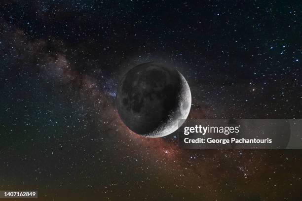 illuminated moon and the milky way - moon stock-fotos und bilder