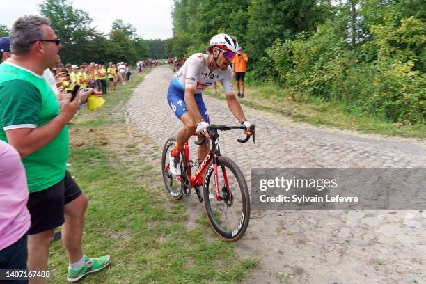 Daniel Oss of Italy and Team Total Energies competes passing through the cobblestones sector of Wallers during the 109th Tour de France 2022, Stage 5...