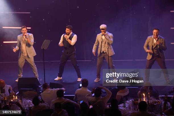 Antony Costa, Lee Ryan, Simon Webbe and Duncan James of Blue perform during the TRIC Awards 2022 at Grosvenor House on July 06, 2022 in London,...