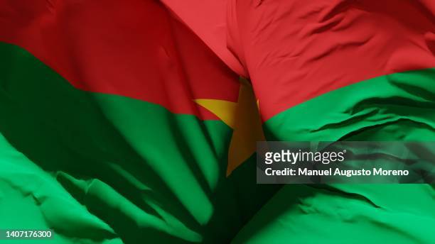 flag of burkina faso - burkina faso fotografías e imágenes de stock