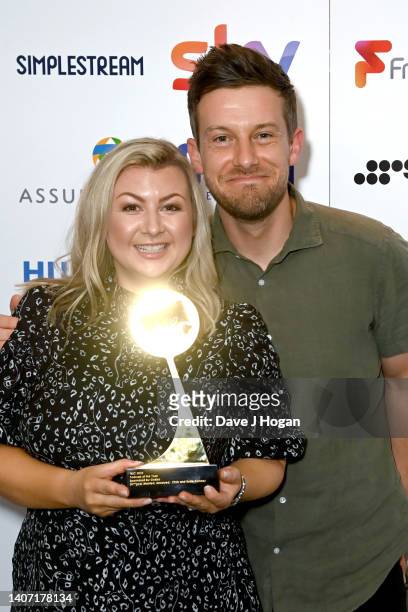 Rosie Ramsey and Chris Ramsey with the award for Podcast during the TRIC Awards 2022 at Grosvenor House on July 06, 2022 in London, England.