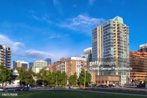 low angle view of modern architecture in calgary, canada - calgary summer stock pictures, royalty-free photos & images