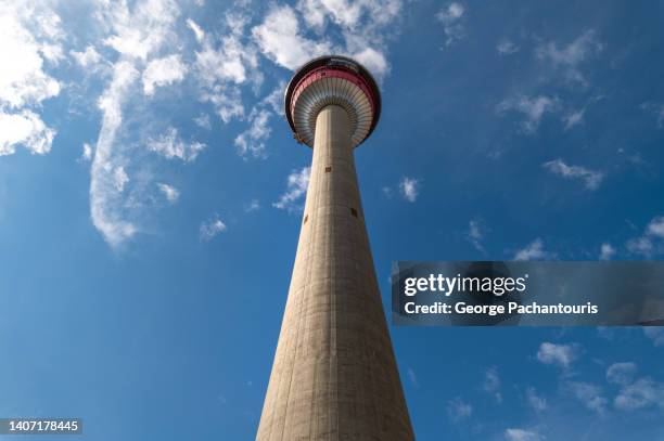 low angle view of calgary tower in calgary, canada - calgary skyline stock pictures, royalty-free photos & images