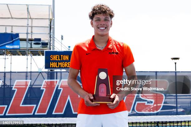 Ben Shelton receives his national champion trophy after defeating August Holmgren of the San Diego Toreros during the Division I Men’s and Women’s...