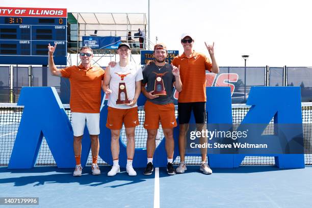 Head coach Bruce Berque of the Texas Longhorns poses alongside Cleeve Harper and Richard Ciamarra of the Texas Longhorns with their national champion...