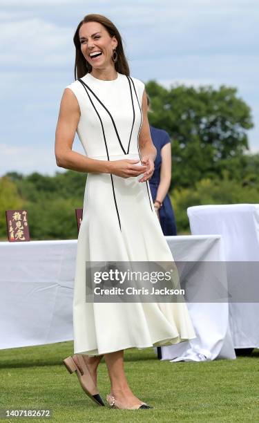 Catherine, Duchess of Cambridge attends the Royal Charity Polo Cup 2022 at Guards Polo Club during the Outsourcing Inc. Royal Polo Cup at Guards Polo...