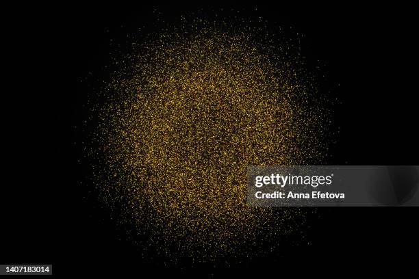 golden glitter splash firming a circle - glitter circle stock pictures, royalty-free photos & images