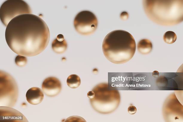 many golden spheres on beige background. christmas celebrating concept. - boule noel photos et images de collection