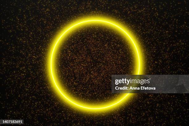 yellow neon circle on glittering background - neon gold stock pictures, royalty-free photos & images