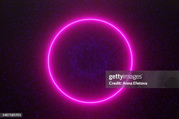 magenta neon circle on glittering background with blue particles - neon stock pictures, royalty-free photos & images