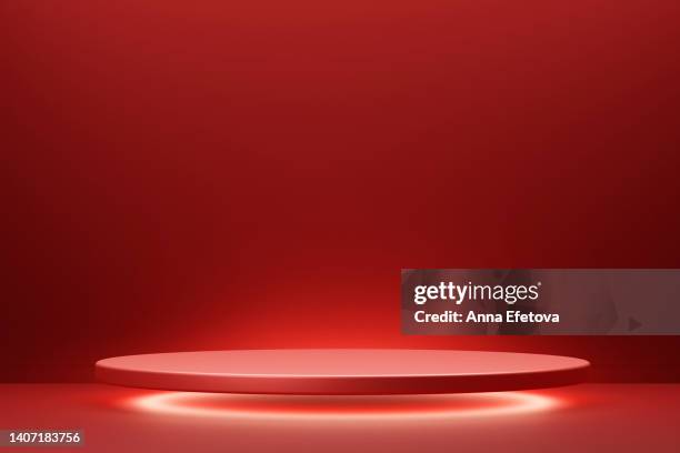 red levitating podium on red background with circle white lightening - red foto e immagini stock