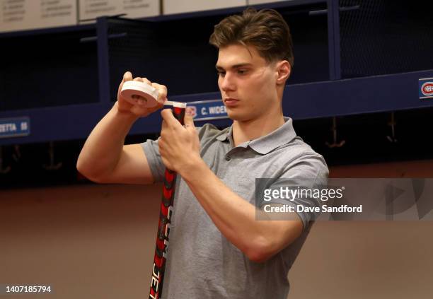 Juraj Slafkovsky tapes his stick before taking part in the 2022 NHL Draft Top Prospect Clinic at Complexe Sportif Bell on July 06, 2022 in Brossard,...