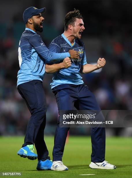 Jordan Thompson of Yorkshire Vikings celebrates with Shadab Khan after victory in the Vitality T20 Blast Quarter Final 1 match between Surrey and...
