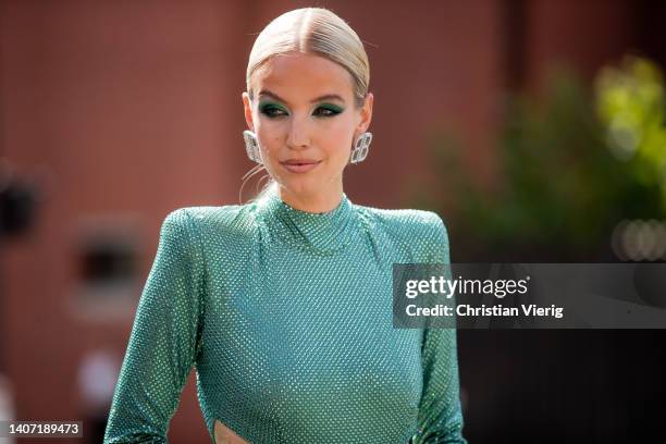 Leonie Hanne seen wearing silver Balenciaga bag, green cut out dress, heels, silver earrings outside Alexandre Vauthier Paris Fashion Week - Haute...