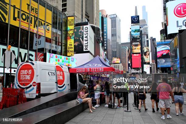 People wait to take a COVID-19 test at Times Square, on June 06, 2022 in New York, United States. Parts of Manhattan back at 20% COVID positivity,...