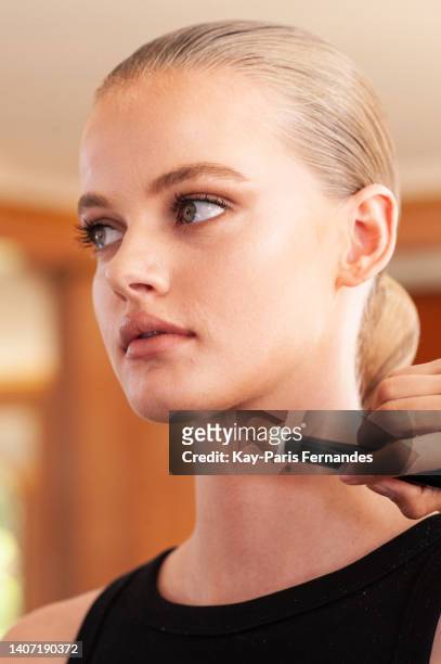 Model prepares backstage prior to the Zuhair Murad Haute Couture Fall Winter 2022 2023 show as part of Paris Fashion Week on July 06, 2022 in Paris,...