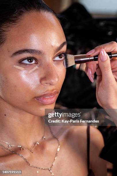 Model has her makeup done by Sofia Tilbury backstage prior to the Zuhair Murad Haute Couture Fall Winter 2022 2023 show as part of Paris Fashion Week...