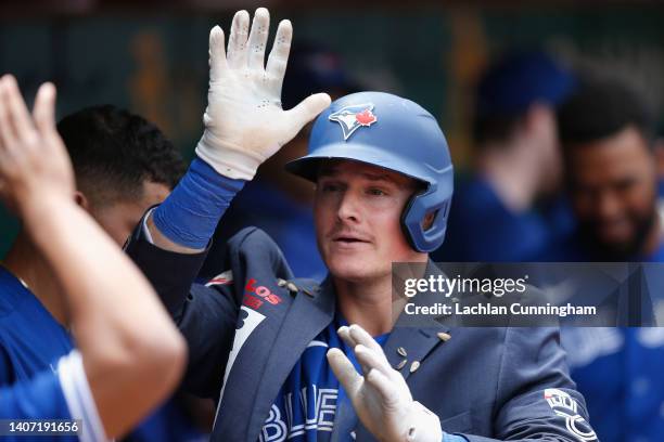 Matt Chapman of the Toronto Blue Jays celebrates after hitting a solo home run in the top of the seventh inning against the Oakland Athletics at...