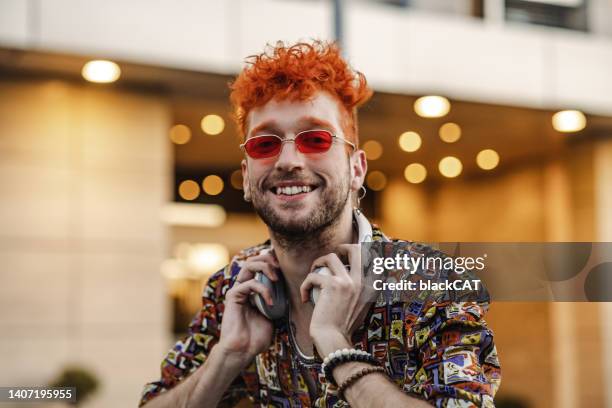 eccentric young man on the street - alternative lifestyle stock pictures, royalty-free photos & images
