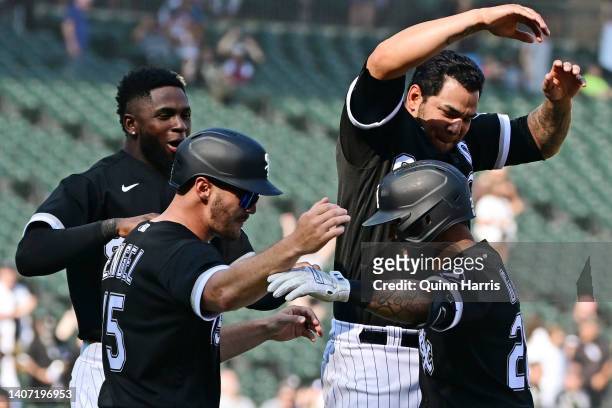 Leury Garcia of the Chicago White Sox celebrates with teammates after his walk-off single in the 10th inning to secure the 9-8 win against the...
