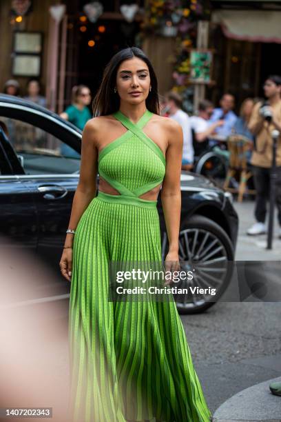 Guest is seen wearing green cut out dress pleated outside Elie Saab during Paris Fashion Week - Haute Couture Fall Winter 2022 2023 : Day Three on...