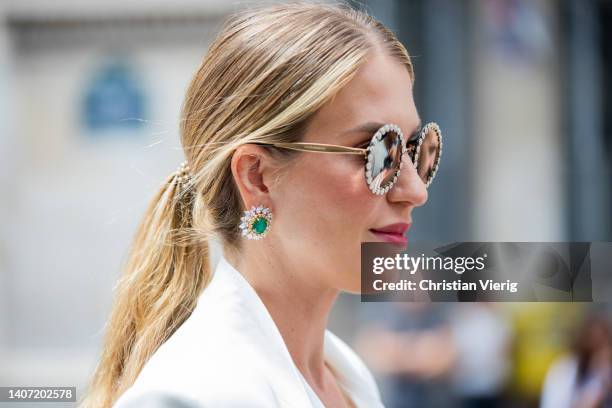 Guest is seen wearing sunglasses, diamond earrings outside Elie Saab during Paris Fashion Week - Haute Couture Fall Winter 2022 2023 : Day Three on...