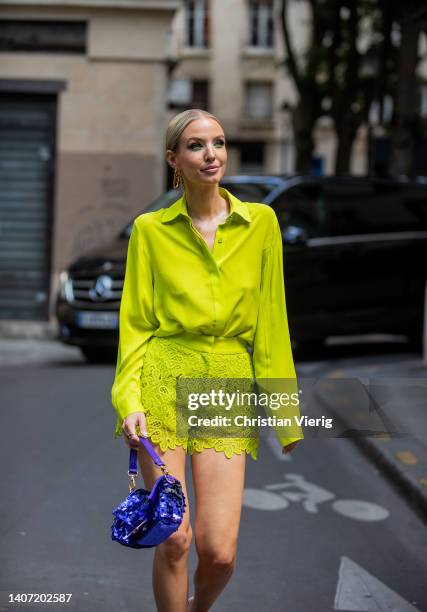 Leonie Hanne seen wearing yellow button shirt, laced shorts, purple bag, heels outside Elie Saab during Paris Fashion Week - Haute Couture Fall...