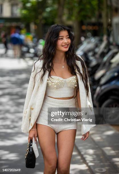 Caroline Hu seen wearing creme white bustier cropped top, blazer, shorts, black Dior bag outside Elie Saab during Paris Fashion Week - Haute Couture...